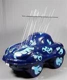 Lot#1, CARTUNES ON PARADE, EPOXY RESIN AND COMPOSITE, CAR SCULPTURE, 2005, H 7', W 3'6", L 7', "LISTEN TO THE RHYTHM OF THE FALLING RAIN"'Cartunes On Parade was the 2005 merger between Detroit, Michigan and Windsor Ontario artists interpreting the melding of the automobile and music, resulting in 150 sculptures created by individual artist from both cities. Sculpture artists Judith and Bob Peebles designed this lot entitled: 'Listen To The Rhythm Of The Falling Rain' and depicts a small blue car with applied stylized raindrops on the body, a clear acrylic cloud with angled rain sheets landing on the roof of the car. . Originally displayed at the Detroit Renaissance Center in Downtown Detroit in 2005. Also displayed at the southeast Michigan 'Dream Cruise' in Detroit in 2012 and the Ann Arbor 'rolling sculpture' in 2012. Perfect object d'art for the corporate lobby or municipal common area.