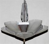 Lot#29, ART DECO STYLE GLASS CHANDELIER, 20TH C., H 16" W 17"Frosted glass and chrome chandelier in the Art Deco style. Measuring H. 16" x 17", 20th Century.
