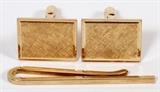 Lot#40, TIFFANY & CO., 14KT YELLOW GOLD, GENTLEMAN'S TIE BAR & CUFFLINKS, L 3/4"-2"Including a pair of yellow gold cufflinks measuring L. 3/4", and a 14kt gold tie bar L. 2", all by Tiffany & Company. Measuring approximately 18 grams in total weight.