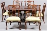 Lot#82, BAKER FURNITURE CO. MAHOGANY DINING SET, MID 20TH C., 9 PCS.Including one mahogany dining table, raised on two tri-pod curved leg pedestal supports, measuring H. 30" x 68" x 44", with three leaves at W. 18" each; together with six side chairs and two open arm chairs. Each piece features the Baker Furniture Co. label at the underside. Mid 20th Century.