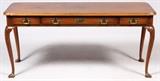 Lot#85, KITTINGER FURNITURE CO., MAHOGANY DESK, H 27", L 60", D 20"In the Queen Anne style, fitted with three drawers, and raised on cabriole legs with drake feet. Measuring H. 27 1/2" x 60" x 20", circa mid 20th Century.