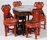 Lot#89, CHINESE RED LACQUER & TEAKWOOD TABLE & SIDE CHAIRS, 5 PCS.Including one round form teakwood table, with an inset marble top, raised on four legs, joined by a lower shelf, measuring H. 31" x 32"; together with four red lacquer side chairs, pierce carved at the side and crest, decorated in stylized floral and leaf motif, measuring H. 36".