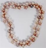 Lot#102, 9.25MM FRESH WATER & JAPANESE AKOYA PEARL NECKLACE, L 14 5/8"Lady's single strand pearl necklace, featuring 9.25mm light pink and lavender fresh water pearls and 6.5mm Japanese Akoya pearls, measuring L. 14 5/8", with a total approximate weight of 65 grams.