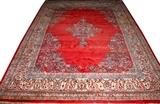 Lot#110, SAROUK, HAND WOVEN WOOL, PERSIAN RUG, W 8' 2", L 10' 5"having a red ground, six borders, large central floral medallion and corner brackets.