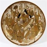 Lot#170, JAPANESE SATSUMA EARTHENWARE CHARGER, C. 1900, DIA 14 1/4", MEIJI PERIOD. Round form charger, decorated with a cluster of figures, the center of which is reading a scroll. Marked at the reverse, measuring Dia. 14 1/4". Circa 1900, Meiji Period.