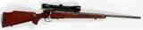 Lot#256, WAFFEN FABRIK MAUSER, M70 BOLT ACTION RIFLE, .243 CAL., AND SCOPE L 25" BBL., #79452/Mauser M70, .243 cal bold action rifle, having a 25" blued barrel, dual set triggers, checkered one piece stock and forearm with Noshoc butt pad. Stamped "Gartman .243" on top of barrel in front of scope. Three round capacity internal magazine. Includes a Leupold VX-1 4-12 X 40mm scope, #354716K. Modern firearm long gun firearms paperwork required.