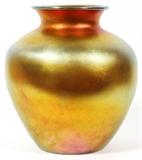 Lot#1004, STEUBEN GOLD AURENE GLASS VASE, EARLY 20TH C., H 12 1/4", DIA 11"Baluster form vase, signed at the underside {see third photograph}. Measuring H. 12 1/4" x 11", early 20th Century.