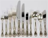 Lot#1025, REED & BARTON 'BURGUNDY' STERLING FLATWARE SET, 20TH C., 180 PIECES.Including 18 dinner knives at 9 7/8", 19 dinner forks at 8", 6 luncheon forks at 7 1/4", 23 fish forks, 13 teaspoons, 34 soup spoons, 8 luncheon knives at 8 3/4", 23 hollow handle butter knives at 6 1/2",  1 hollow handle master butter, 13 flat butter spreaders, and 12 appetizer forks, all in the Burgundy pattern by Reed and Barton. Grouping also includes 8 additional teaspoons, and 2 hollow handle butter spreaders in the French Renaissance pattern. Circa mid 20th Century.