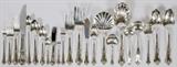 Lot#1027, INTERNATIONAL 'JOAN OF ARC' STERLING FLATWARE SET, 139 PIECES (SERVICE FOR TWELVE)Sterling silver flatware set includes 12 place knives, L.9 1/4", 12 place forks, L.7 1/4", 12 salad forks, 12 place/oval soup spoons, 12 hollow handle butter spreaders, 12 cocktail/seafood forks, 12 iced tea spoons, 12 demi tasse spoons, and 24 teaspoons, as well as 1 medium cold meat fork, 1 small cold meat fork, 1 salad serving spoon with scalloped bowl, 2 serving spoons, 1 pierced serving spoon, 1 gravy ladle, 1 cream ladle, 1 pierced tomato server, 1 pickle fork, 1 jelly server, 1 master butter knife, 2 sugar shell spoons, 1 lemon fork, 2 bon bon spoons, 1 cheese server, and 1 pie server.  Not monogrammed.  Totaling approximately 121.45 troy oz. weighable.  Together with 1 non-matching grape shears.