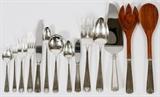 Lot#1028, GORHAM 'ETRUSCAN' STERLING FLATWARE SET, 115 PIECES (SERVICE FOR TWELVE)Sterling silver set includes 12 place knives, L.8 1/2", 12 place forks, L.7", 12 salad forks, 12 gumbo soup spoons, 12 hollow handle butter spreaders, 12 oyster forks, 12 iced tea spoons, 12 ice cream forks, and 12 teaspoons, as well as 1 cold meat fork, L.8 1/2", 3 serving spoons, 1 pie server, and a 2-piece salad serving set with wood bowl and tines.  Not monogrammed.  Totaling approximately 93.8 troy oz. weighable.