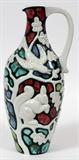 Lot#1078, ERIK PLØEN POTTERY EWER, H 14.5"Having a squirrel, bird and leaf motif.