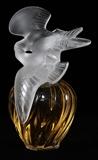 Lot#1096, LALIQUE 'L' AIR DU TEMPS' CLEAR & FROSTED GLASS PERFUME FACTICE, H 12"A frosted glass stopper in the form of two lovebirds surmounts the swirl-molded bottle; signed "Lalique France" about the rim of the base.  Measures H.12" x 9".