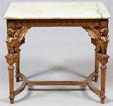 Lot#1120, FRENCH STYLE GILT WOOD CENTER TABLE WITH ONYX TOP, H 29 3/4", W 33", D 23"A rectangular onyx top raised on four sphinx figural and fluted supports joined by stretchers.  Measures H.29 3/4" x 33" x 23".  Early 20th century.