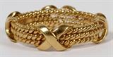 Lot#1128, TIFFANY & CO. SCHLUMBERGER 18KT YELLOW GOLD BAND RING, SIZE 8 1/2.Formed as three braided bands bound by four X shapes.  Stamped "Tiffany & Co. Schlumberger 750".  Weighs approximately 7 grams.  Size 8 1/2.
