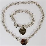 Lot#1131, TIFFANY & CO. STERLING SILVER BRACELET & NECKLACE, L 7" & 15".Including one bracelet with a heart shaped pendant, measuring L. 7"; together with one necklace, measuring L. 15". Each by Tiffany & Company, New York, having a total approximate weight of 2.805 tr.oz.  Two items total.