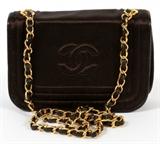 Lot#1179, CHANEL MOCHA SILK SHOULDER BAG, W 7"A single flap at the front, clipping open to a leather-lined interior with one zippered pocket. Stamped: Chanel, Made in Italy in gold. Measuring H.4 1/2" x 7", L. 18".