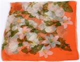 Lot#1185, CHANEL SILK SCARF, 38" X 38"/Decorated with clusters of white flowers on a peach ground. Labeled within print: Chanel. Measuring L.38" x 38".