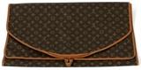 Lot#1189, LOUIS VUITTON MONOGRAM CANVAS GARMENT BAG, L 57 1/2"Monogram canvas garment bag, with brown leather trim. Measuring H.57 1/2" x 23 1/2".