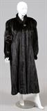 Lot#1204, KAY ANOS FURS MINK COAT, H 51" W 24", GROSSE POINTE, MICH.Lady's full length mink fur coat, with a buttoned collar. Labeled: Kay Anos Furs, Grosse Pointe, Michigan at the interior. Measuring H. 51" x 24", L. 26" to the shoulder.