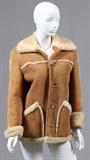 Lot#1211, LADY'S SHEARLING 3/4 LENGTH COAT, H 31" W 18"Fitted with five front bottoms and open pockets at either side. The coat measures H. 31" x 18", L. 23" to the shoulder.