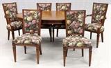 Lot#1247, PROVINCIAL STYLE DINING TABLE, CHAIRS (8), CHINA CABINET & SERVER.Matching set includes 1 dining table, H.31" x 66" x 45", with two leaves, W.18" each, with 2 armchairs and 6 side chairs with floral upholstery, and 1 china cabinet.  Together with 1 coordinating server by the Mount Airy Chair Co., fitted with a single drawer, flanked by faux drawers, and cabinet doors at the base, H.34" x 61" x 18" (see additional photo).  Eleven items total.