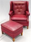 Lot#1252, RED LEATHER ARMCHAIR & OTTOMAN.The lounge chair measures H.37" x 31" x 28"; Hudson's label.  Two items total.