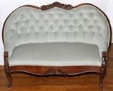 Lot#1564, FRENCH STYLE MAHOGANY SETTEE, C. 1900, L 33"Serpentine railed with floral-carved crest, tufted back.  Measures H.46", L.33".