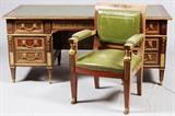 Lot#2041, ITALIAN EXECUTIVE DESK AND CHAIR.The Italian tooled leather top desk features overall bronze ormolu, a central drawer flanked by three drawers on each side.  H 31.5", L 72", D 34.5".  Accompanied by a desk chair with bronze ormolu, figural mounts, paw feet and green leather back and seat.