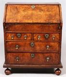 Lot#2042, WILLIAM & MARY/QUEEN ANNE WALNUT SLANT-FRONT DESK, C. 1700-15, H 36", W 30", D 18"Walnut and burl walnut veneers, the slant-front hinges open to a fitted interior with slots and six drawers, above two short drawers and two long drawers, raised on bun feet.