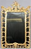 Lot#2049, ROCOCO STYLE GILT FRAME WALL MIRROR, H 71", W 43"Gold leaf frame; FB Decorative Arts, Inc., Miami label on verso; c. late  20th c.