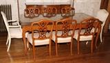 Lot#2206, FRENCH STYLE WALNUT DINING SET, ELEVEN PIECES.Including 1 dining table, H.29" x 64" x 43", with two leaves (18" wide), 2 painted white armchairs, 6 side chairs, 1 china cabinet, H.76" x 46" x 16", and 1 sideboard, H.36" x 65" x 22 1/2".  Mid 20th century.