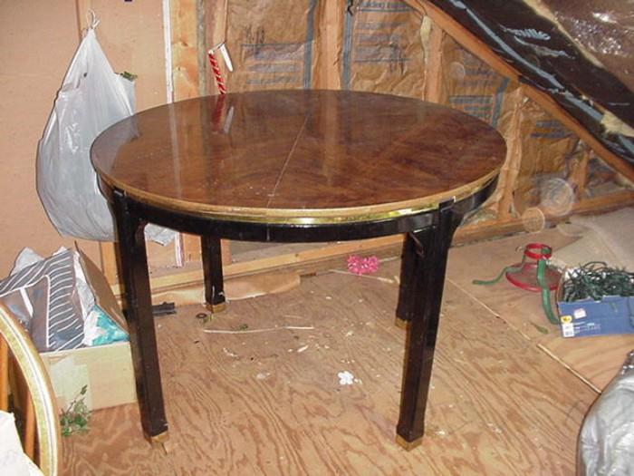 Wood table with black laminate legs and brass accents--one center leaf included