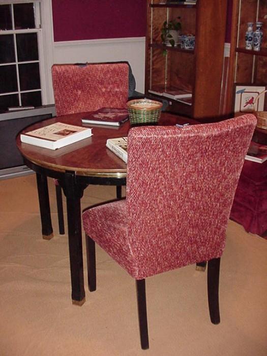 Two upholstered side chairs with round table