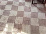 Neutral tone square pattern wool rug, approx 8' by 11'