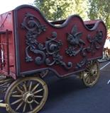 Lot#:	272
Description:	Antique Calliope Style Horse Drawn Wagon
This is 1 of 70 wagons that will be sold between November 2014 and February 2015!
Take a trip back in time when the Old West, or the Wild West, was being explored and settled. The buggies, carriages, wagons and coaches featured in this auction are authentic relics of the frontier history. These items are from the Richard Bunger Estate in Payson, AZ and were purchased by Mr. Bunger from various places including the McElhaney Cattle Co Museum in Yuma, AZ. This lot features a Calliope style wagon with wood framed and paneled box with straight front and scalloped upper edge and rear. Mounted on a steel reinforced wood frame with braking system and steel spring suspension. Decorations on each side include applied wood molding of scrolled plumes and flowers with a bird in the center. The body is painted red, molded details painted gold and steel rimmed wood spoke wheels and under-carriage painted yellow. The paint is peeling and