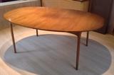 Oval walnut dining table - 6 ft. long.  Comes with two 20" leaves (table extends to more than 9 ft. with leaves in)