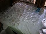 Large amount of star cut crystal stemware used for parties