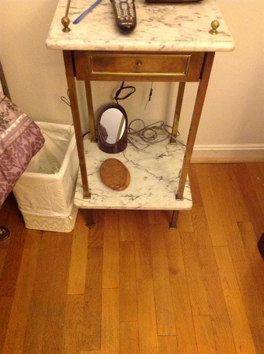There is a pair of these side tables