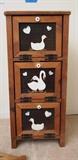 Small country style pie cabinet with ducks painted on the front: 15X11X35 showing wear. Country wall mount shelf: 17X5X32, showing minor wear. Small painted black table: 14.5X14.5X10, showing dirt and wear. Small wood wall mount shelf: 18X6X5.5. Wood wall mount shelf: 24X6X9. Shelves in good sturdy condition showing minor wear.