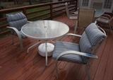 Round Outdoor Table And Chairs Glass Table: 41.X27.75. 6 chairs included that don't match the table: 27X24X36. Two chairs have cushions. Includes umbrella stand. All show some wear.