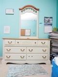 Mirror And Dresser Off white dresser 56X14X30 and matching mirror 29X48. One handle broken. 