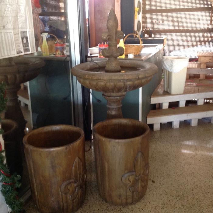 The water fountain is 5' tall and the planters are 2' tall x 18" wide