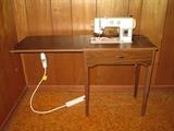 Signature sewing machine with cabinet