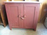 Nice old wood cabinet with older red paint.