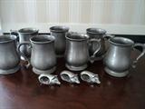 Pewter, pewter, and more pewter mugs.  Look at those great pig napkins rings!!