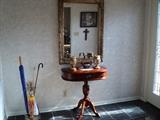 Nice footed foyer table, mirror, and antique umbrella stand!