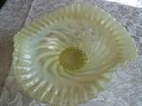 Antique yellow swirl bowl is very unusual!