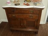 Original hardware and bow front make this washstand very special!