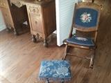 Look at this small footstool with fringe and iron legs!
