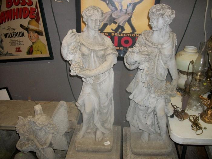 concrete statues on bases